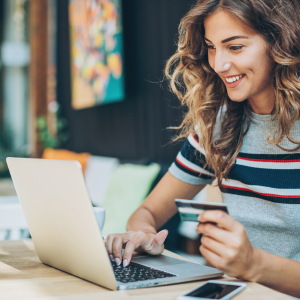 Lady at home shopping online for her Avon products